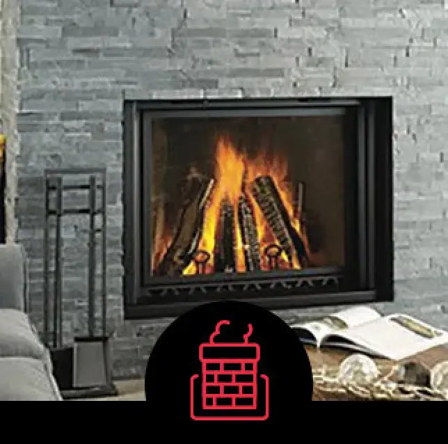 Lit fireplace set in a gray stone surround.