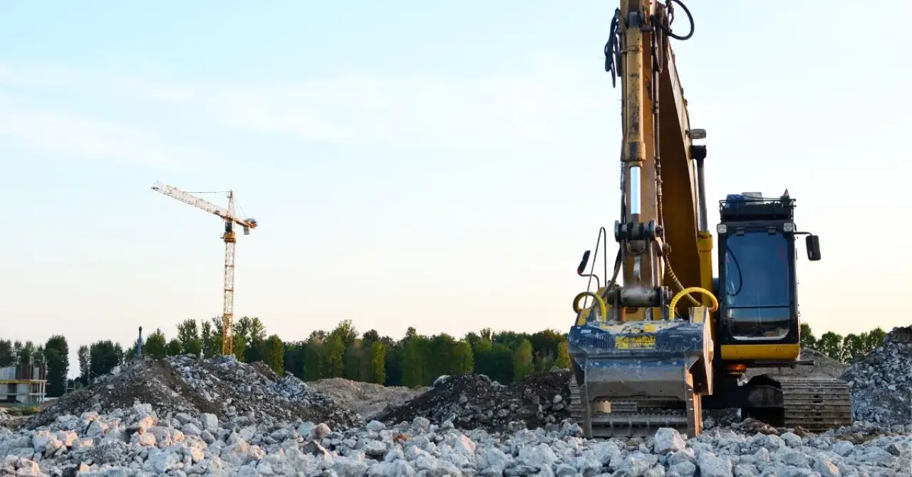 Construction truck recycling aggregates within concrete.