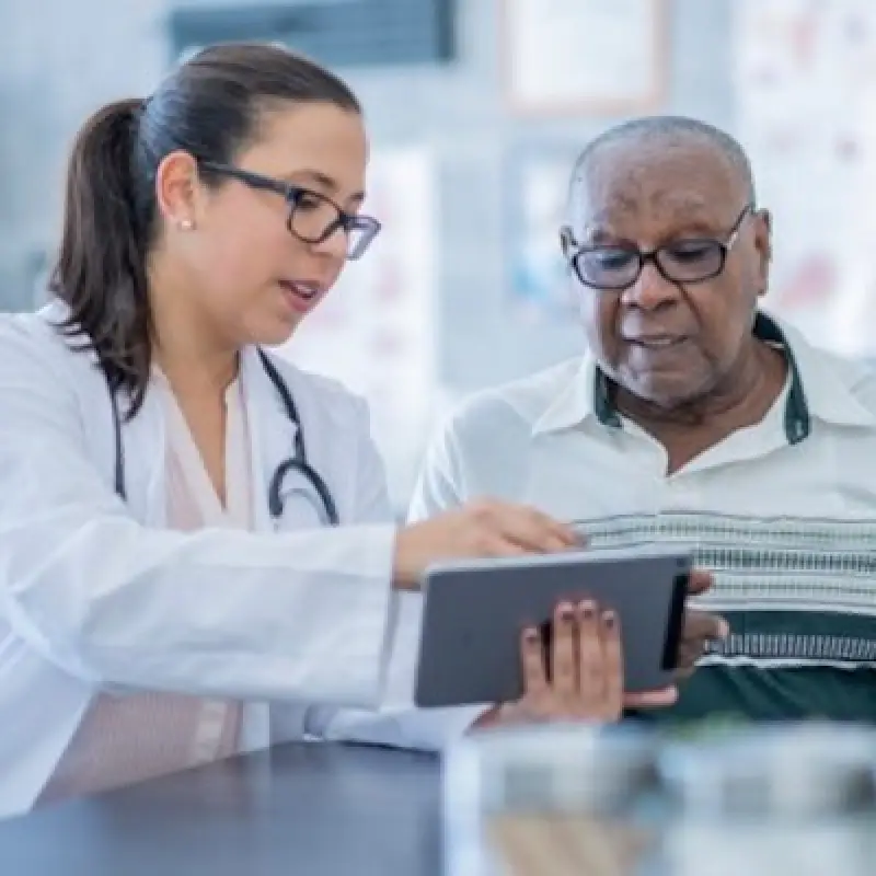 eye doctor explaining cornea surgery to a patient