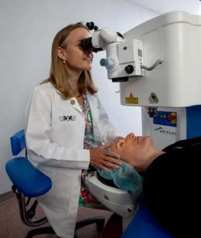 Doctor examing eyes with femtosecond laser