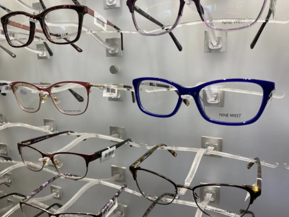 Eye glasses displayed on a wall.