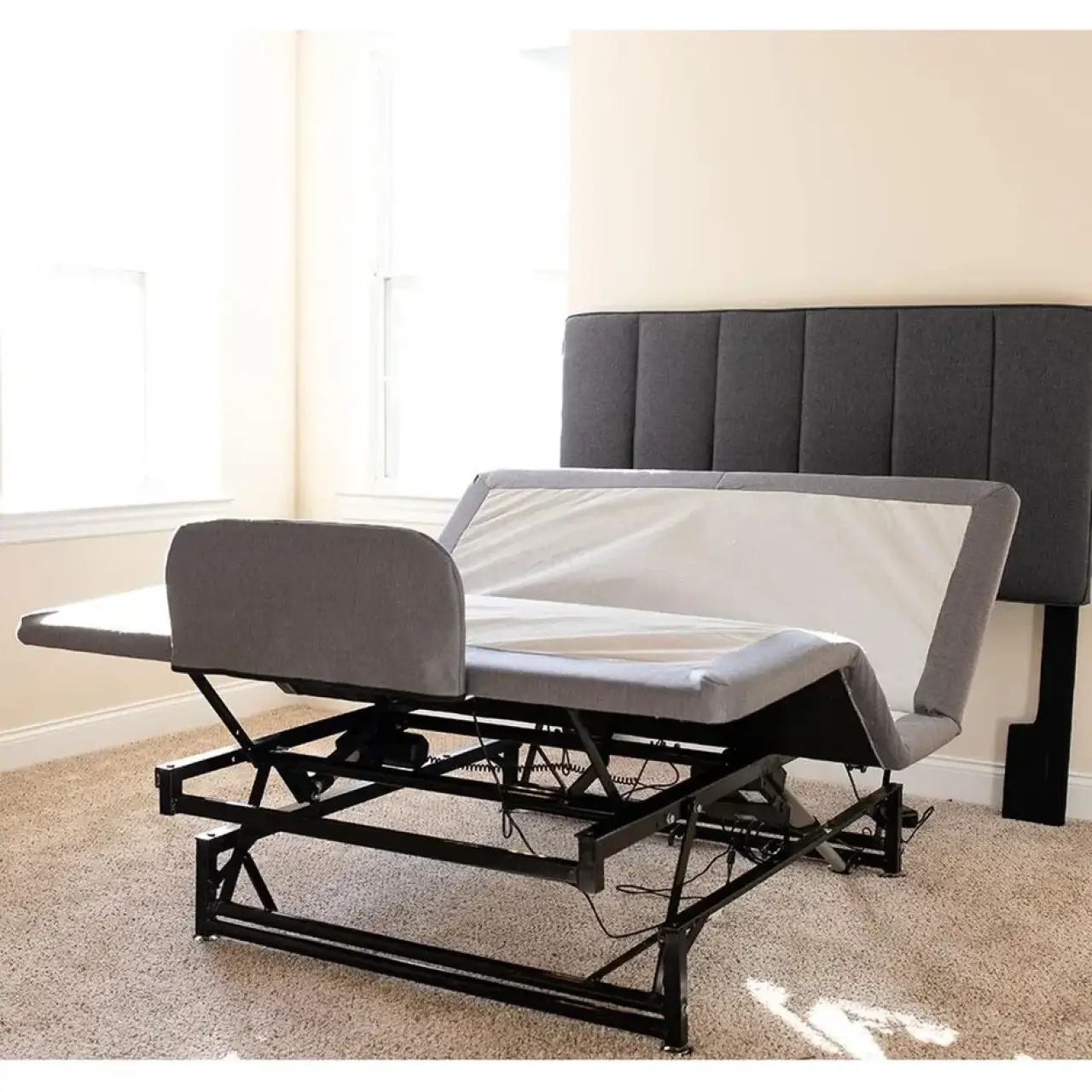Flex-A-Bed adjustable bed with raised sections and exposed lift mechanisms.
