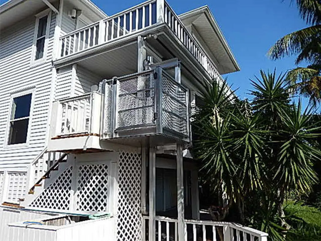 a white house with a deck