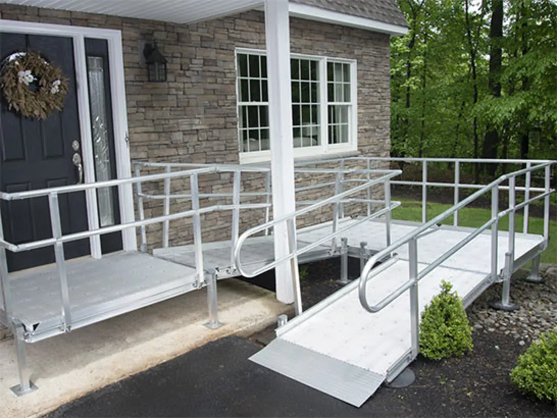 a white metal railing in front of a house