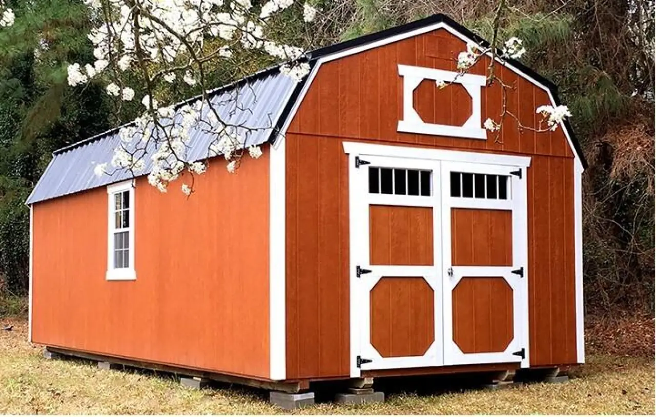 Orange storage shed with white trim