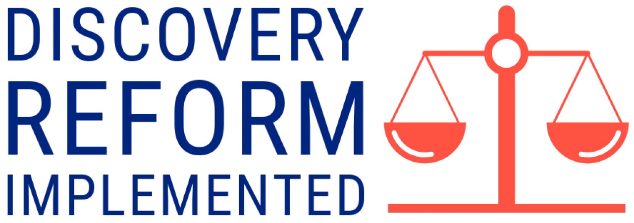 Discovery reform implemented, illustrated with balanced scales of justice.