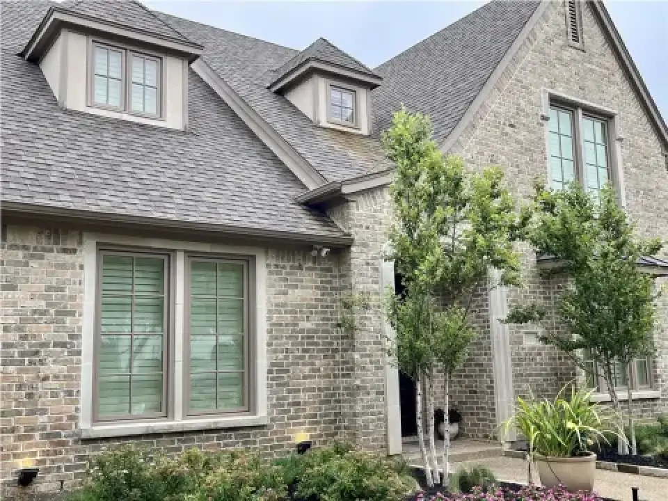 brick house with dormer windows