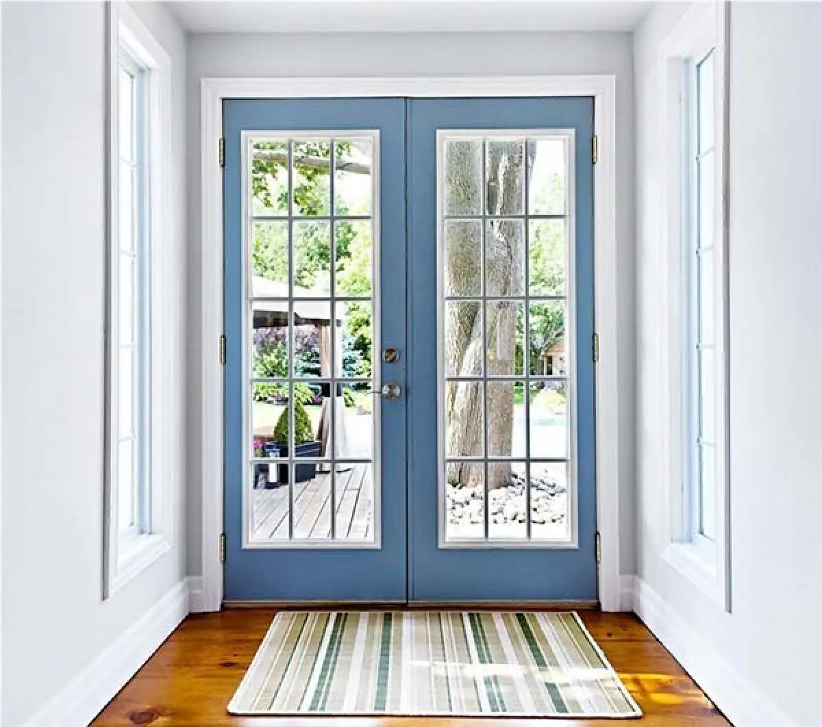 Blue French patio doors with divided glass panes.
