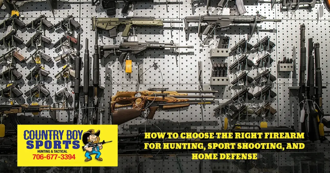Handguns, rifles, and shotguns displayed on a Country Boy Sports showroom wall.