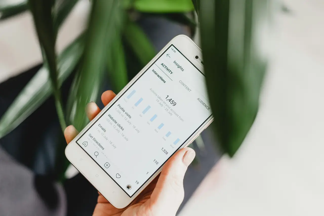 a phone showing social media apps for a marketing agency