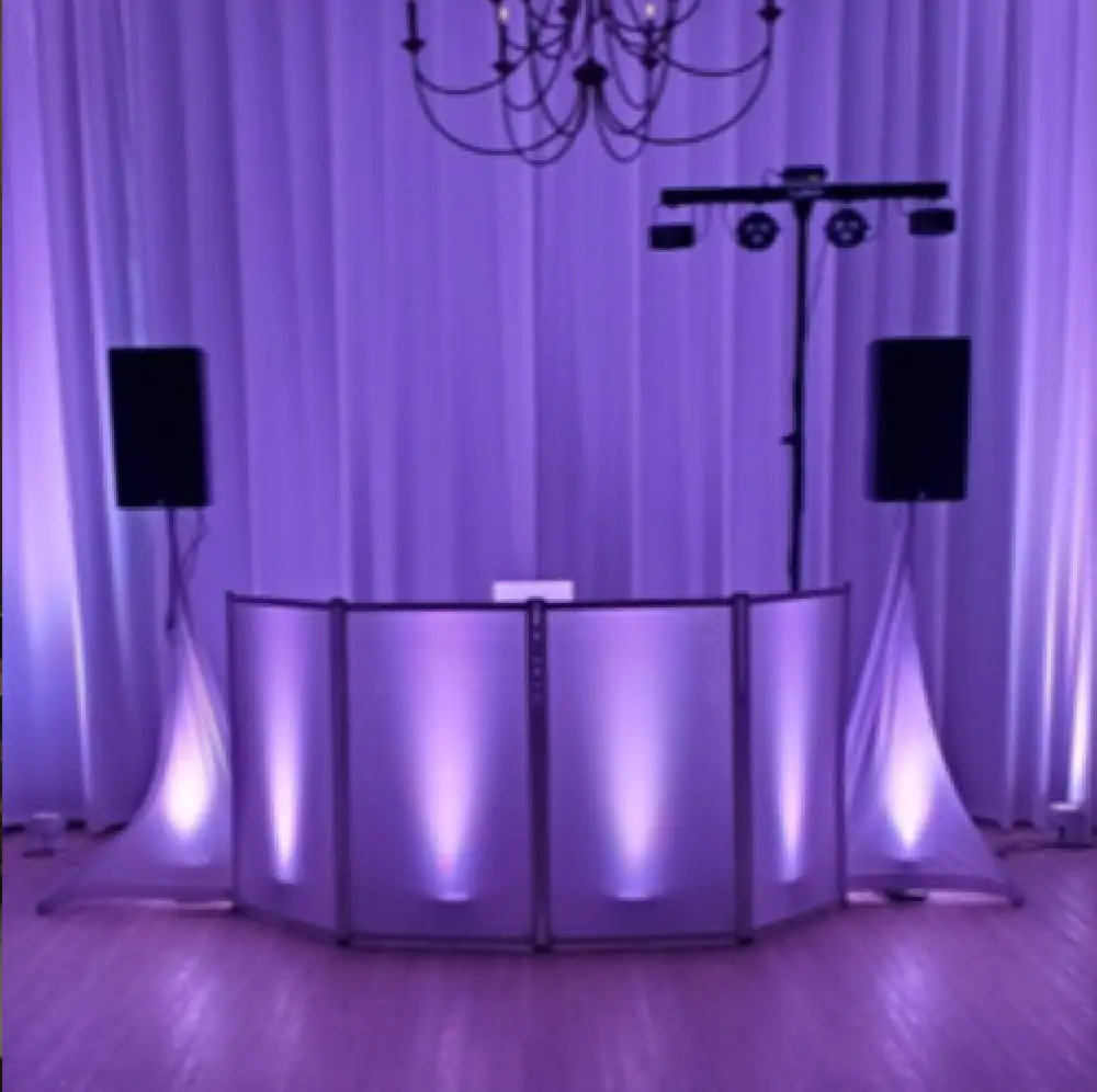 DJ booth with purple backlighting