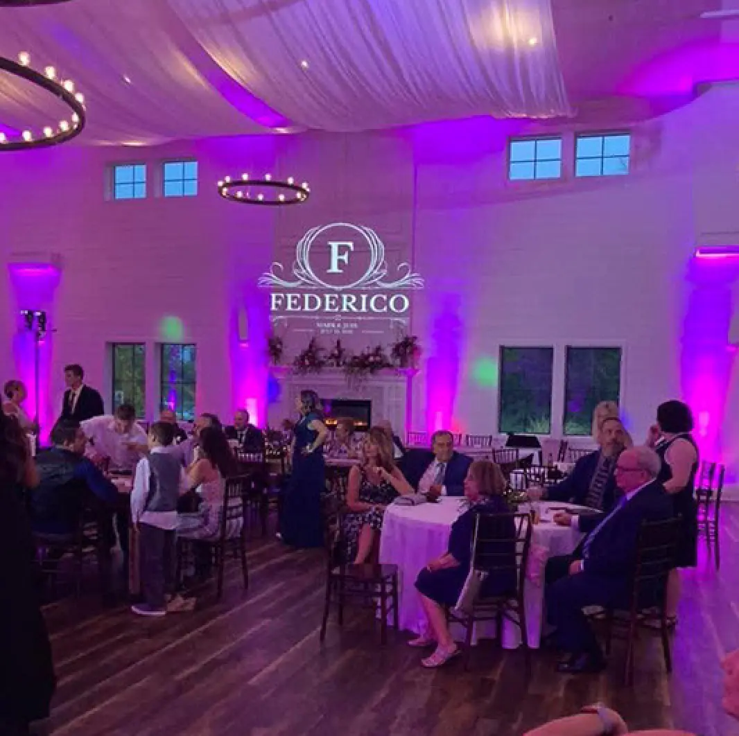 Wedding reception with custom monogram uplighting