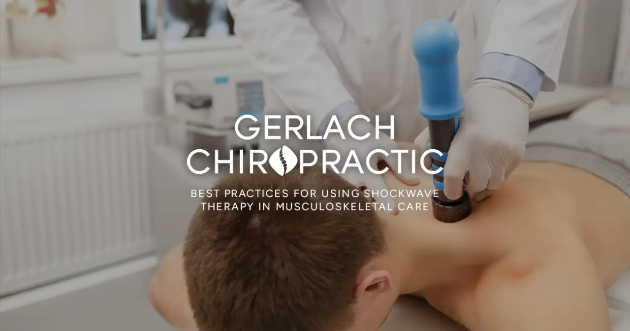 performing shockwave therapy on a patients back