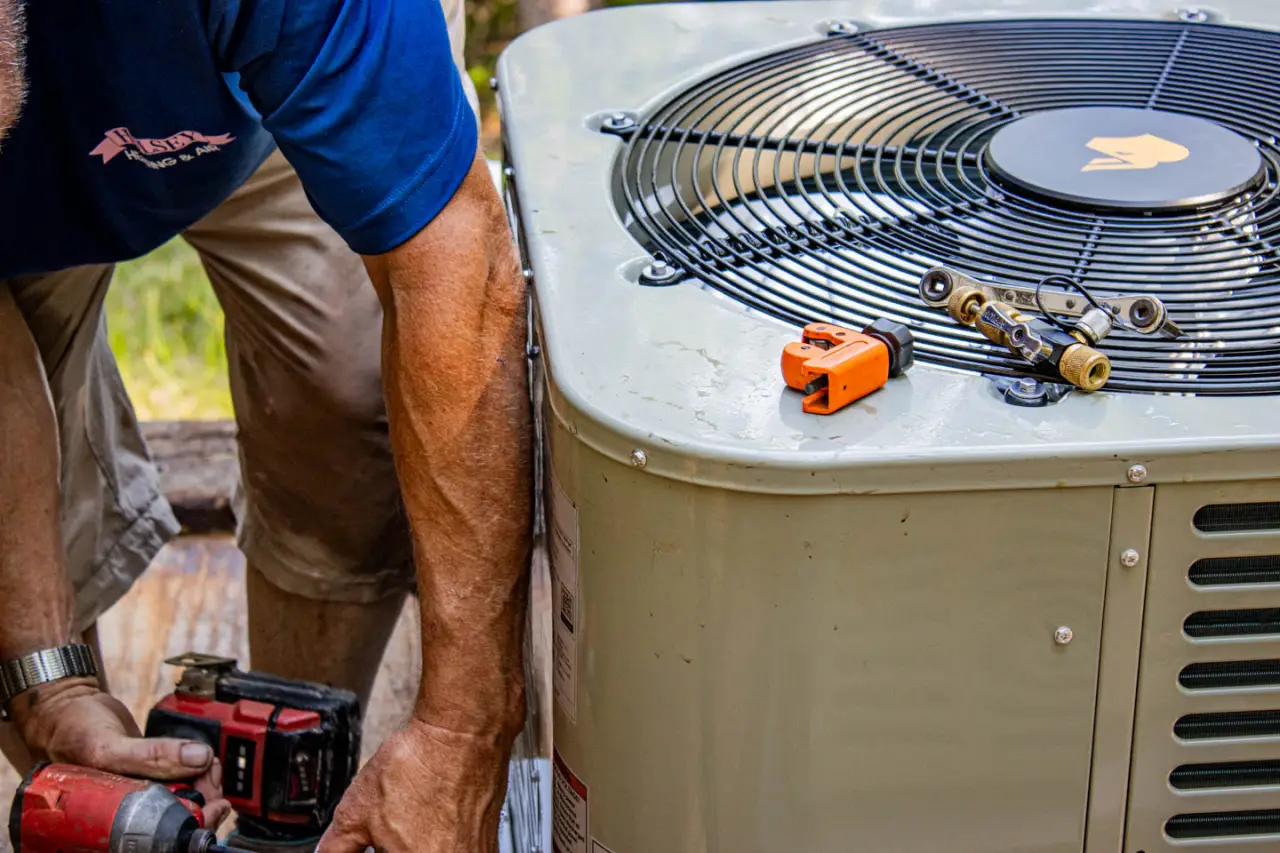 Hulsey employee securing an AC unit