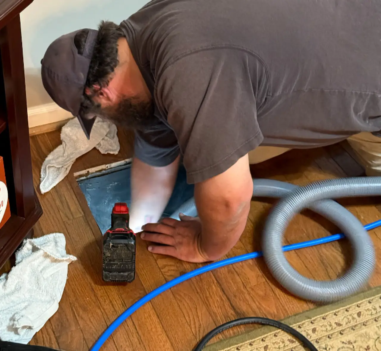 Hulsey technician cleaning an air duct