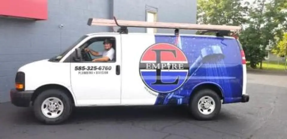 Man driving an Empire Heating & Air Conditioning van.