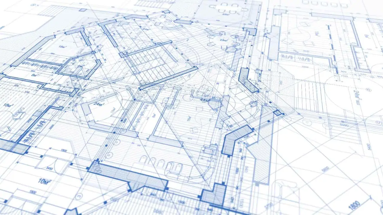 Blue architectural plans with detailed layout lines and measurements.