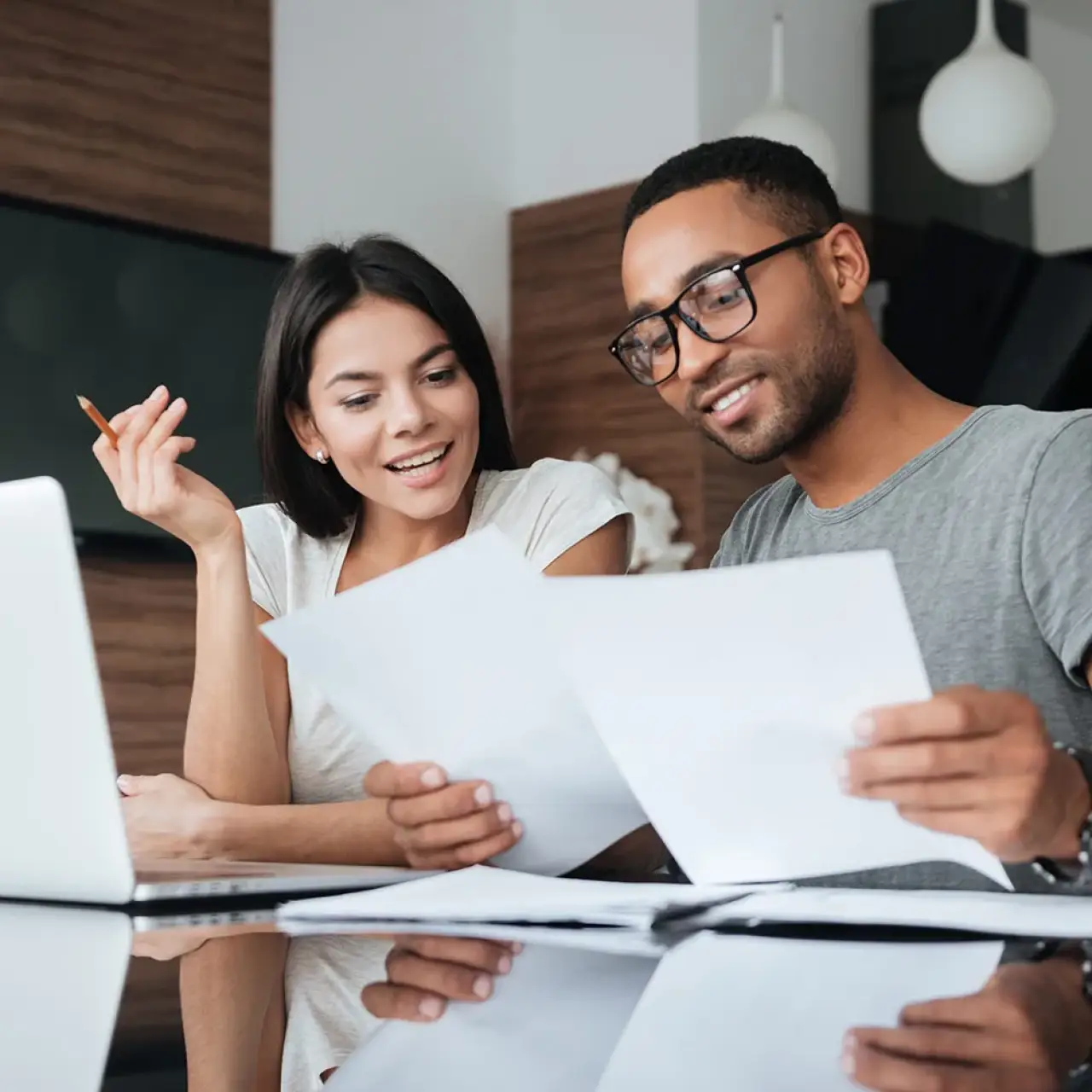 Couple reviewing financing documents