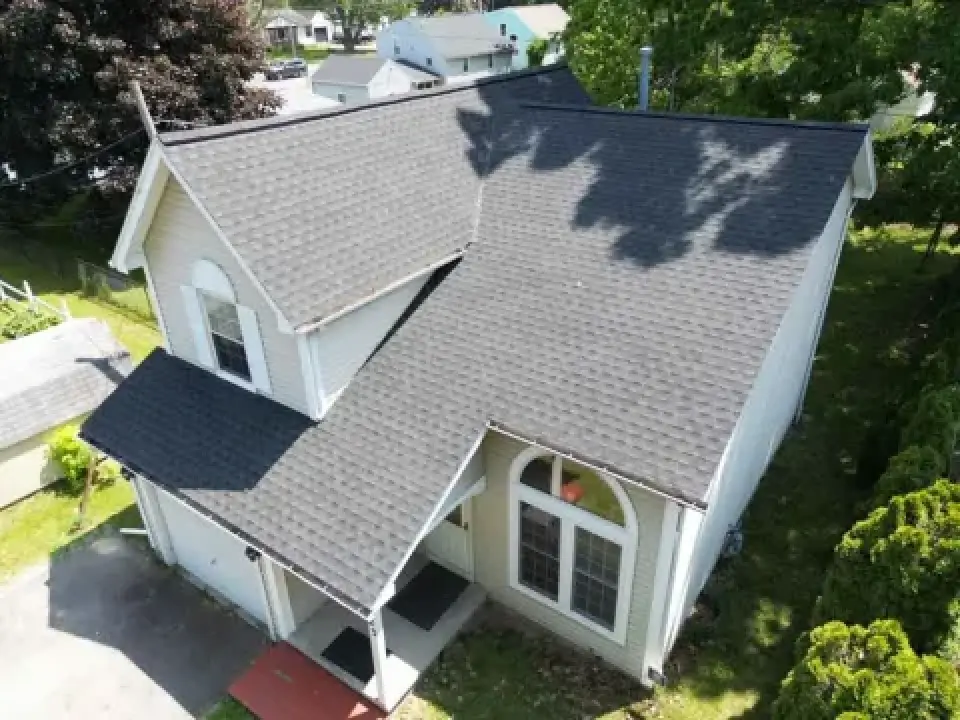 Aerial view of a Rochester home with a gray asphalt shingle roof.