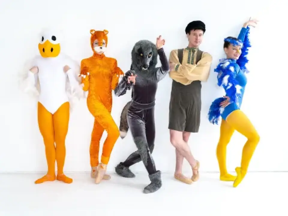 Five dancers pose in colorful Peter and the Wolf costumes.