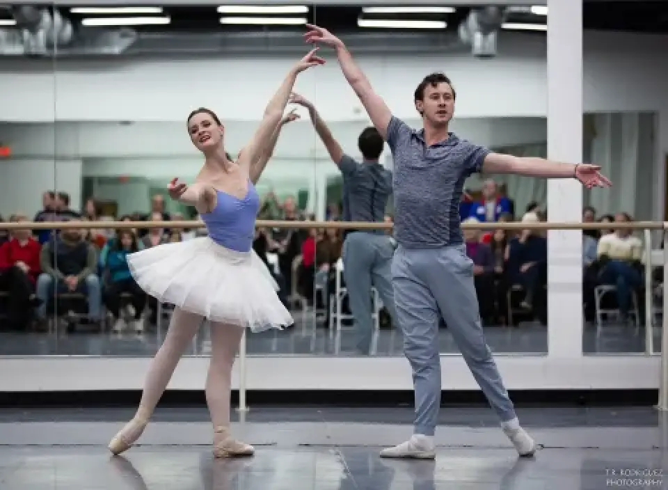 Rochester City Ballet dancers rehearse in a studio with an audience.