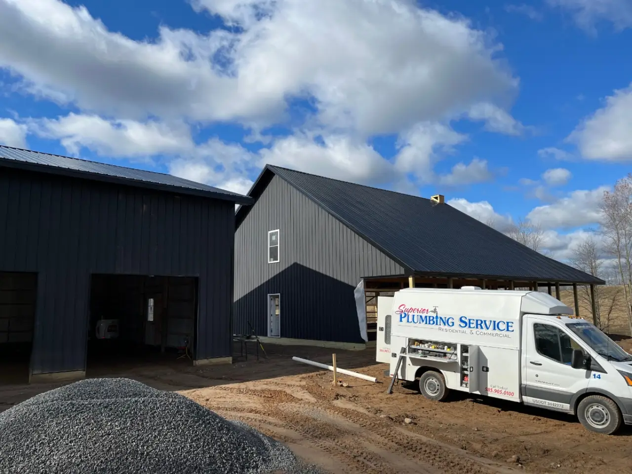 Superior Plumbing Service van at a construction site