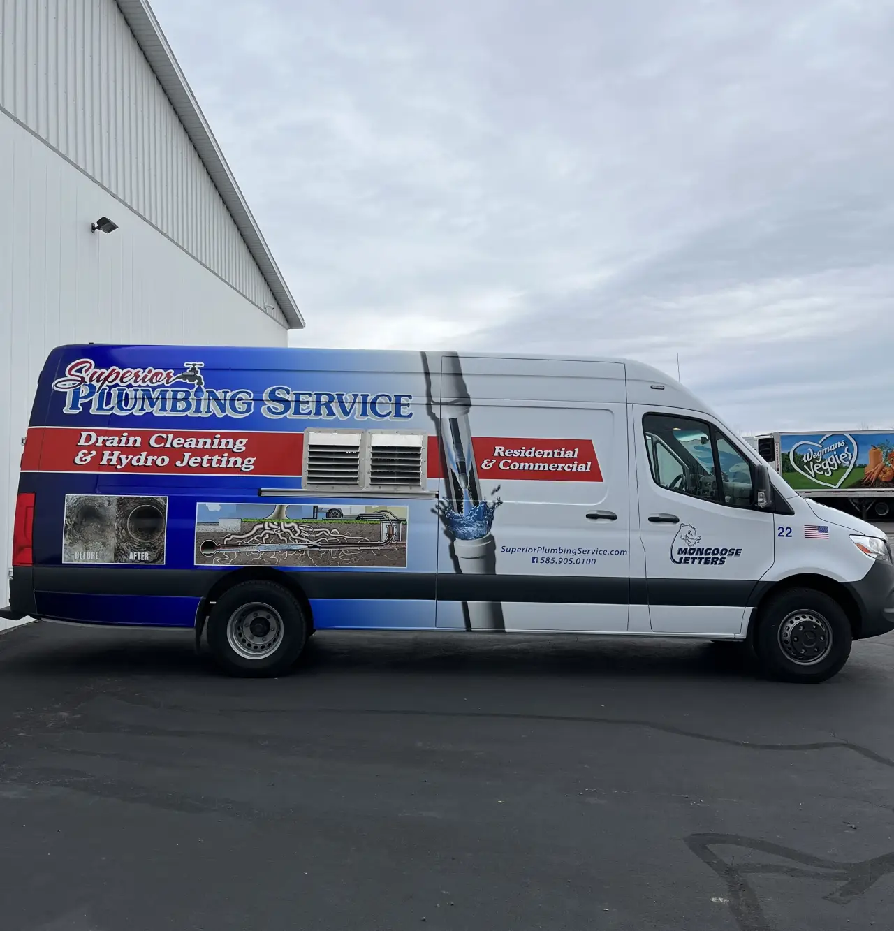Superior Plumbing Service van parked outside with company branding and plumbing services displayed on the side.