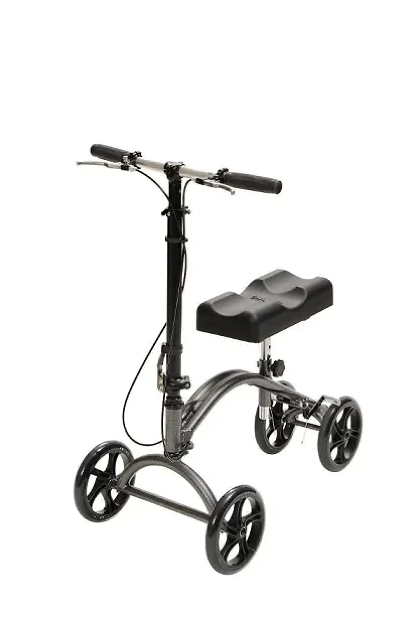 Four-wheeled knee walker with padded knee rest and handlebars.