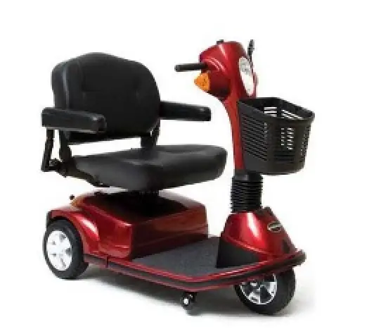 Red three-wheel mobility scooter with padded seat and front basket.