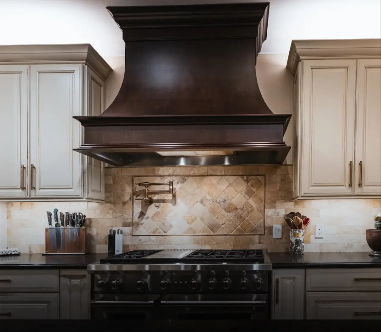 A new stove with a brown hood.