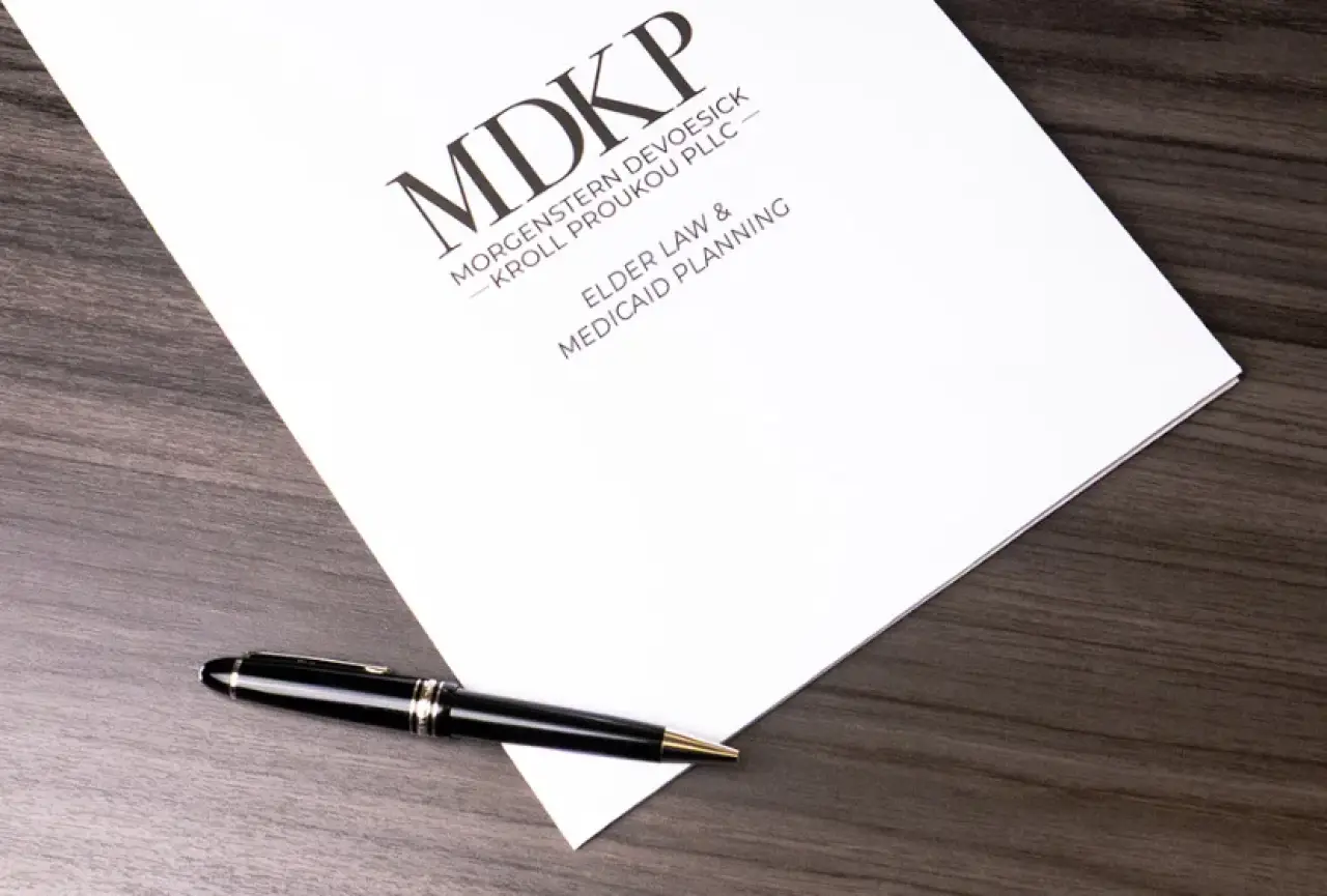 White paper on desk with elder law medicaid planning