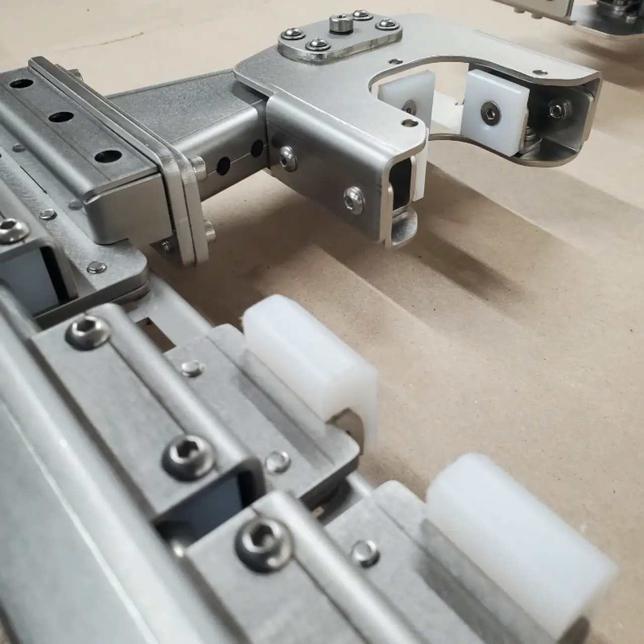 Standoffs and PEM nuts installed along a formed steel rail