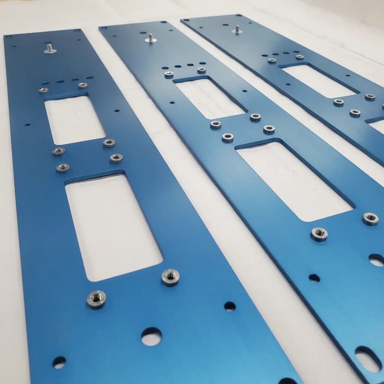 Blue coated panels with pneumatically installed rivnuts