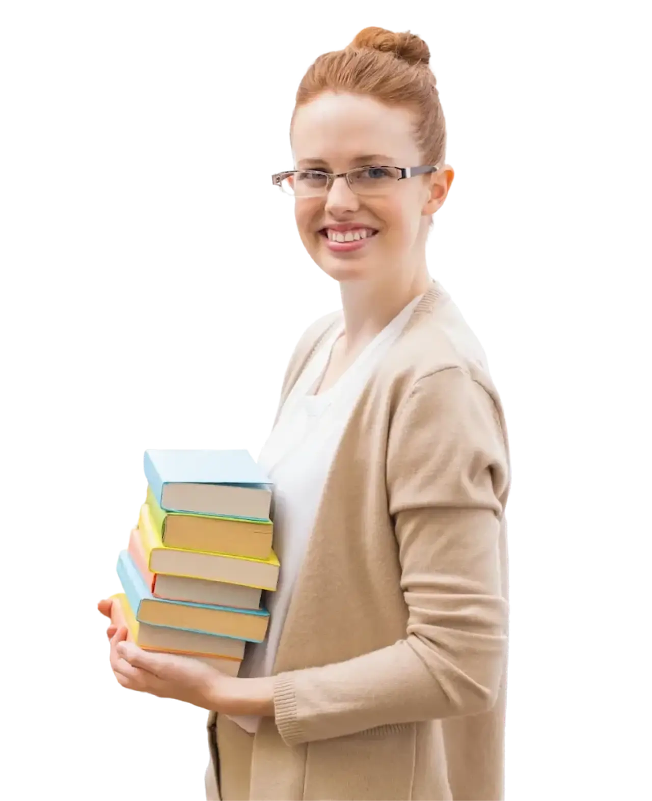 A smiling long-term substitute teacher, wearing a beige cardigan, stands sideways holding a stack of books.