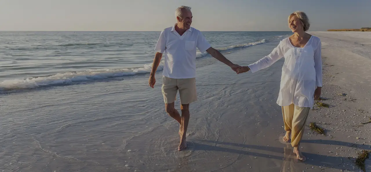 holding hands on the beach