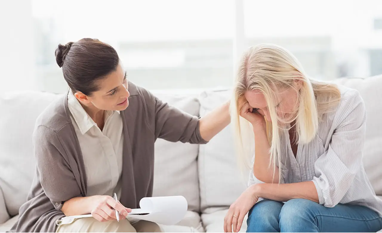 Grief counselor comforting a client during a grief counseling session in Jacksonville FL