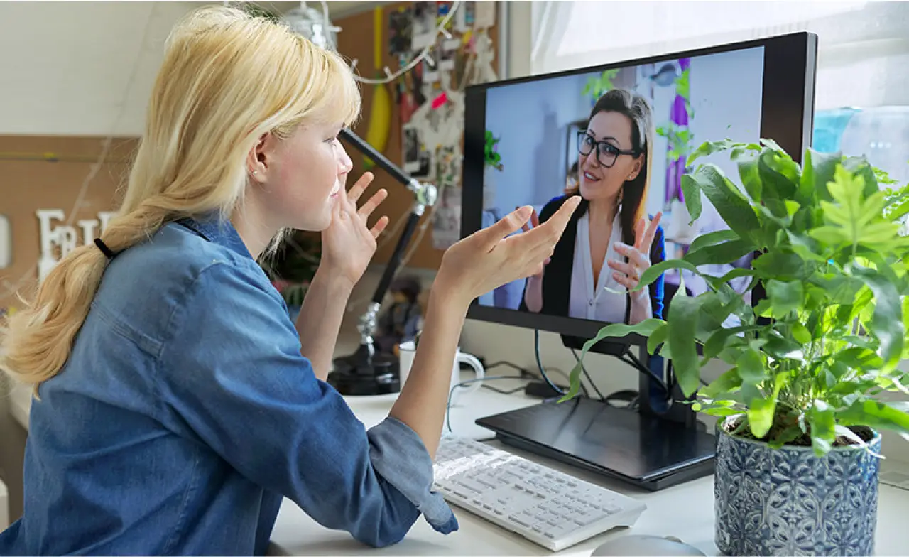 Woman receiving online counseling via video call with her therapist from home in Jacksonville FL