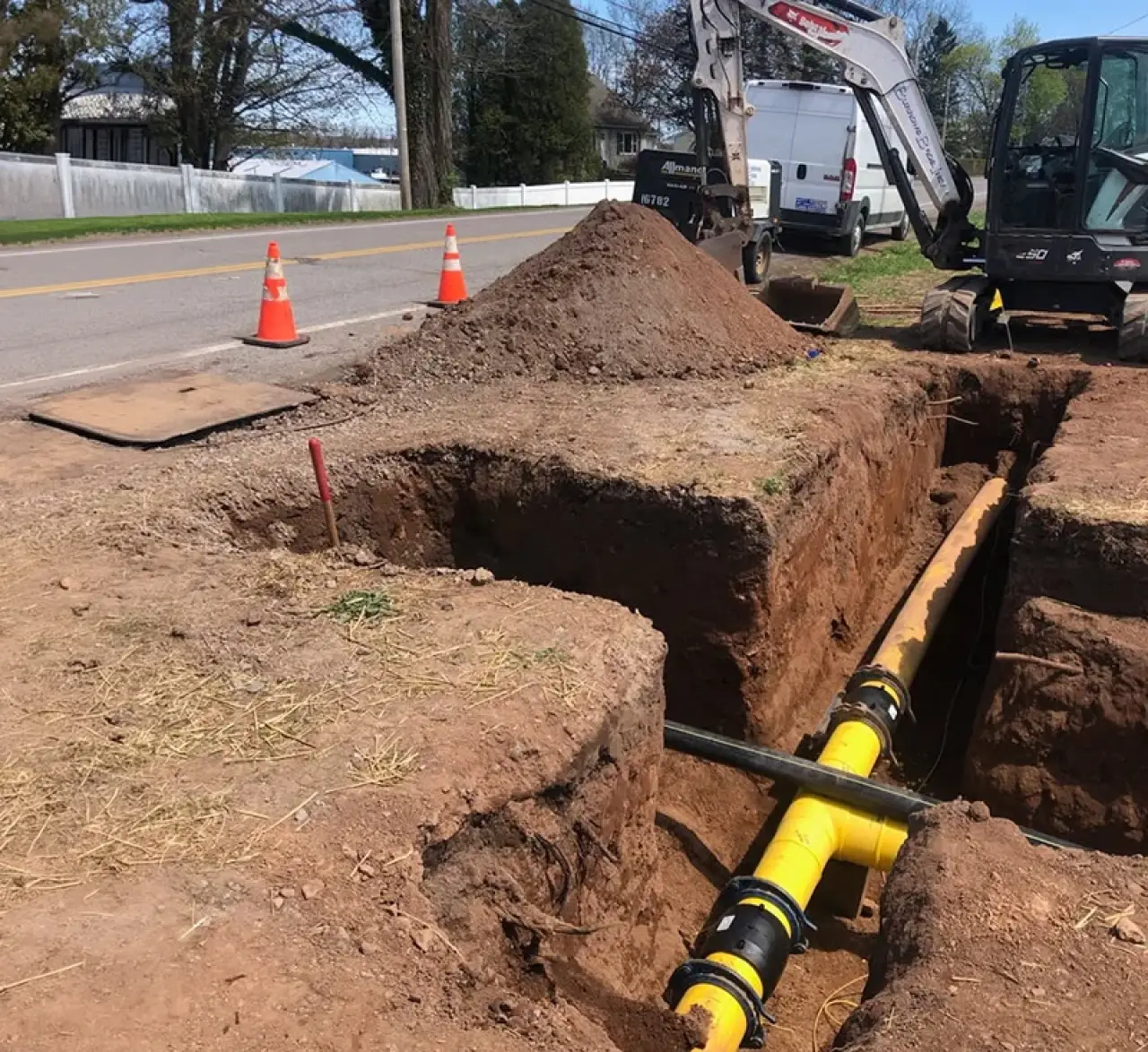 two team members working in a trench from burrows bros in rochester ny