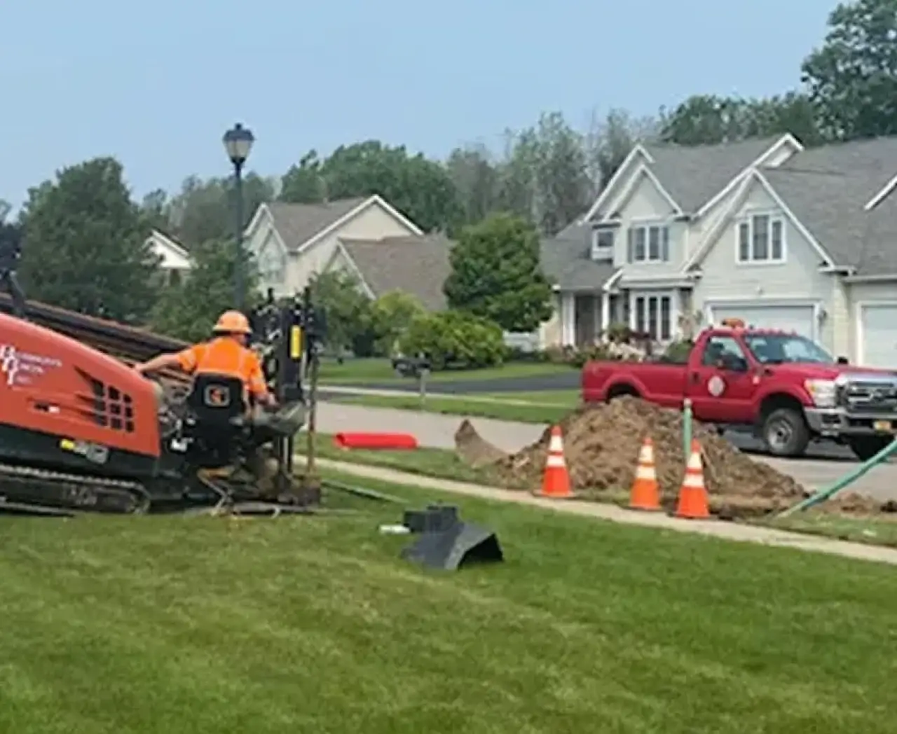 burrows bros digging a trenchless solution in a home yard
