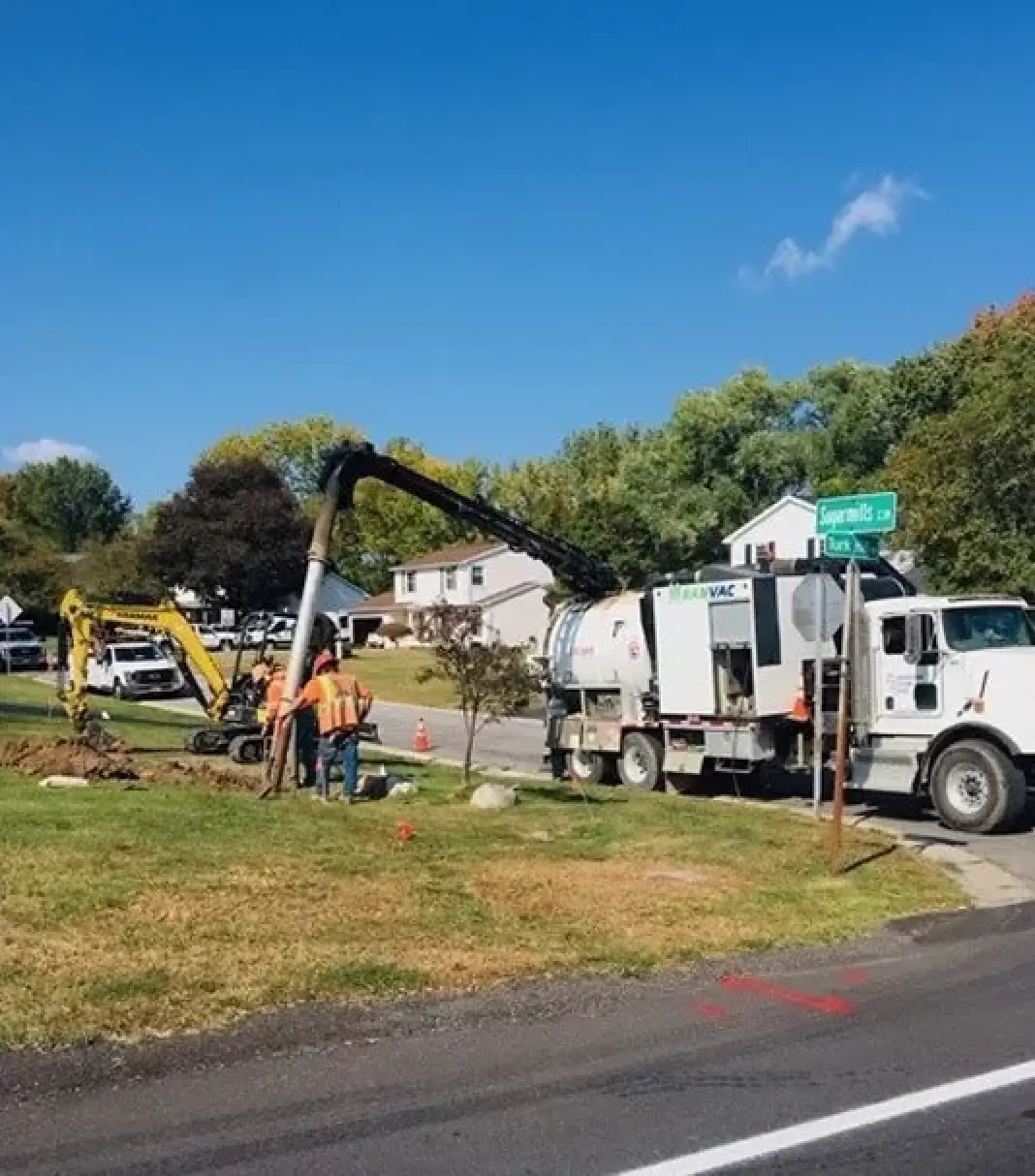 burrows bros digging a trenchless solution in a home yard