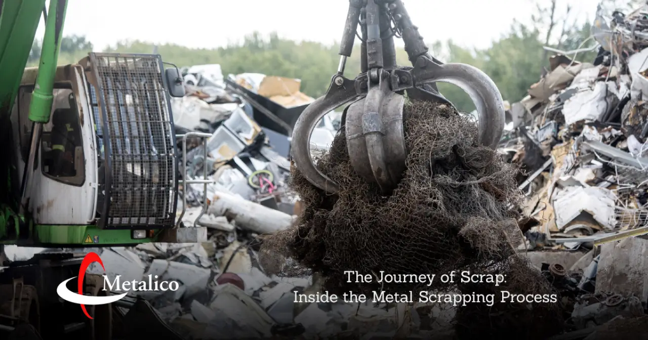 crane lifting metal in scrap yard