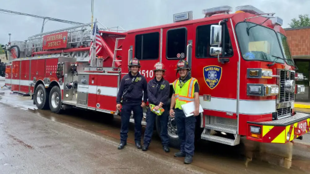 firefighters in front of firetruck