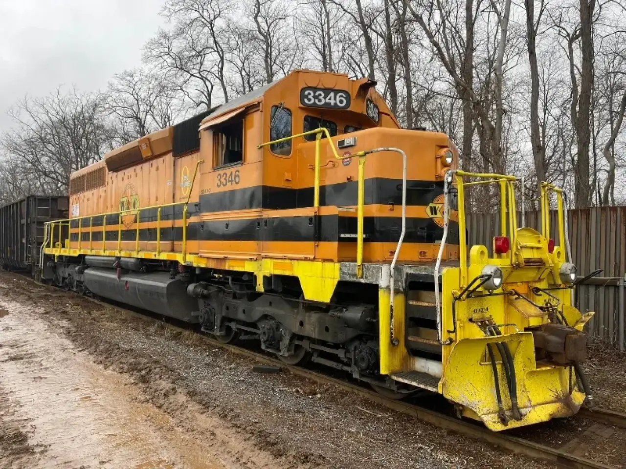 yellow train and train tracks