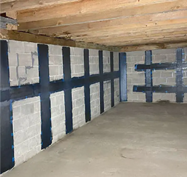 An unfinished basement with a Stabl-Wall system stabilizing the basement walls