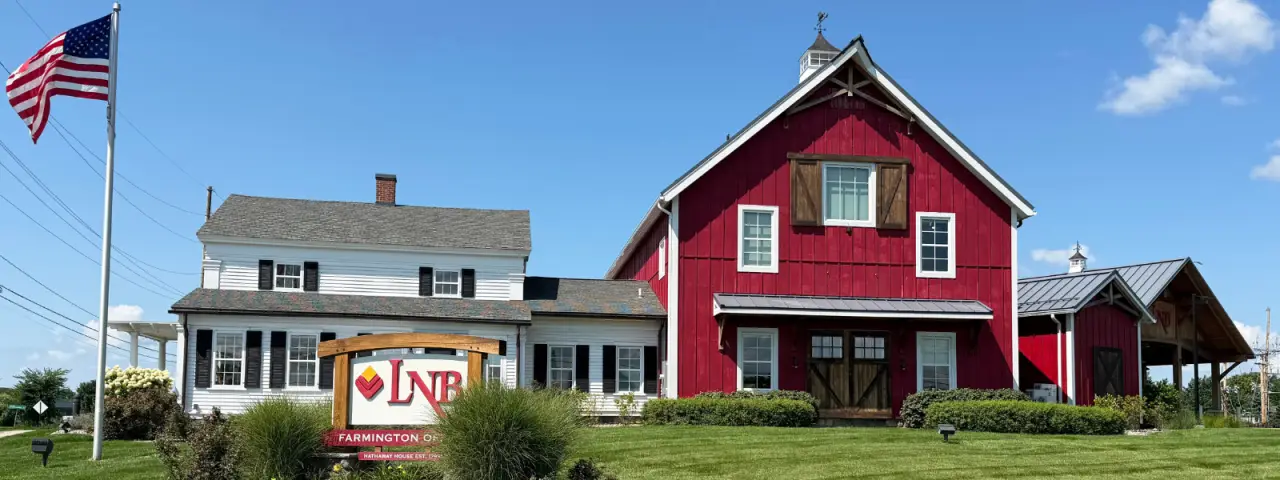 Lyons National Bank’s red barn-style Farmington branch with drive-up lanes.