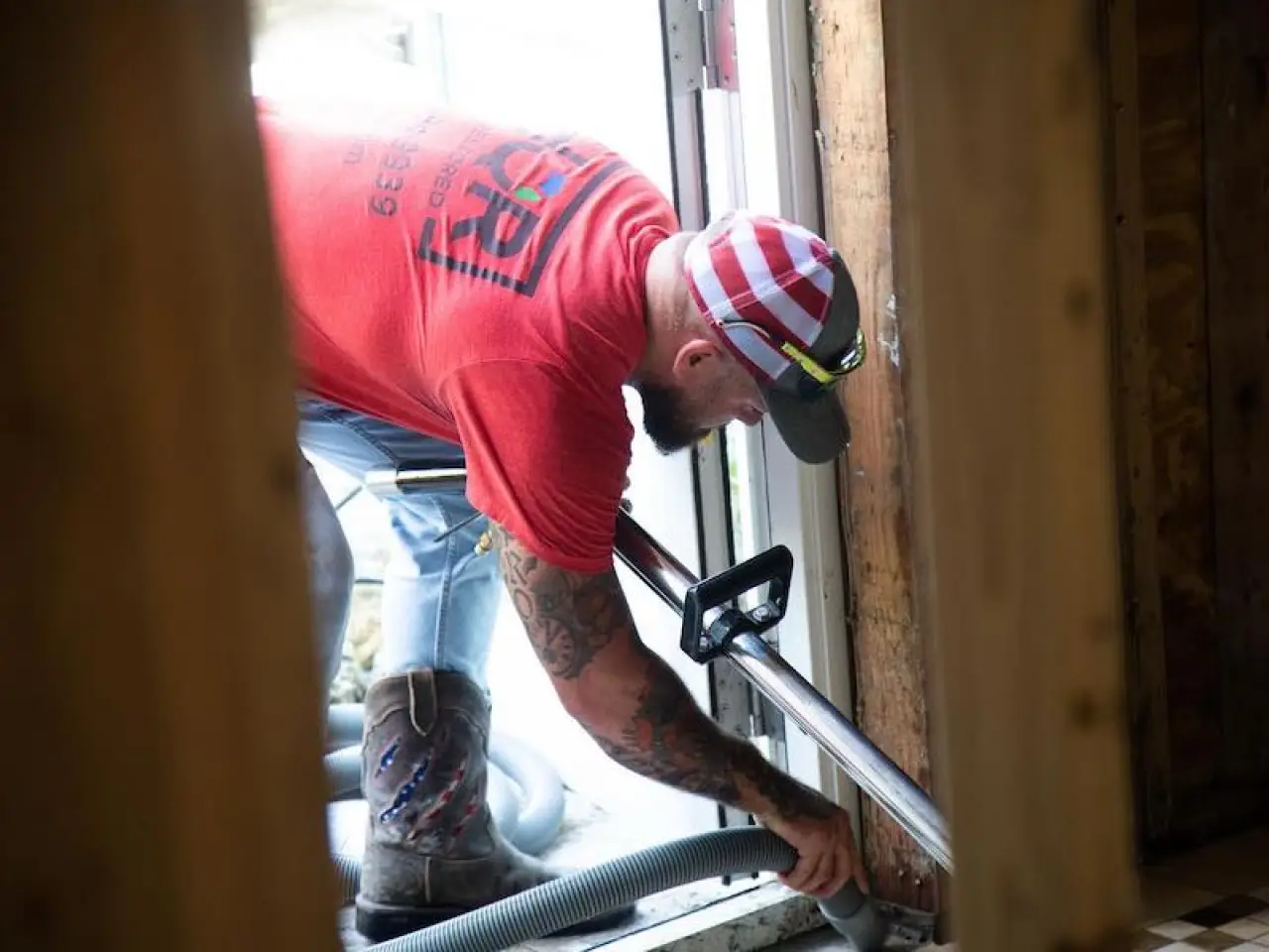 employee cleaning up during demolition