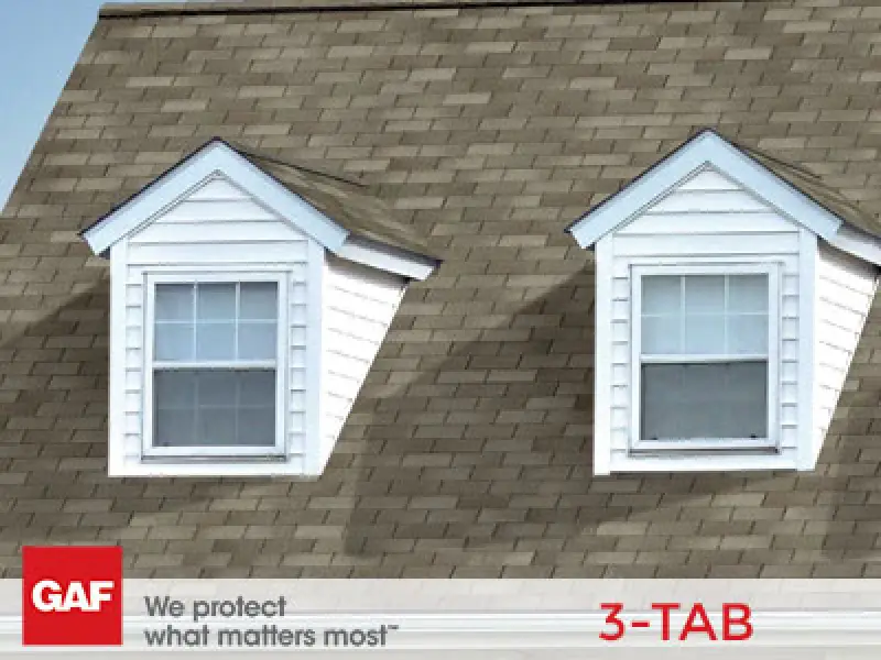GAF 3-tab shingles on a roof with two dormer windows.