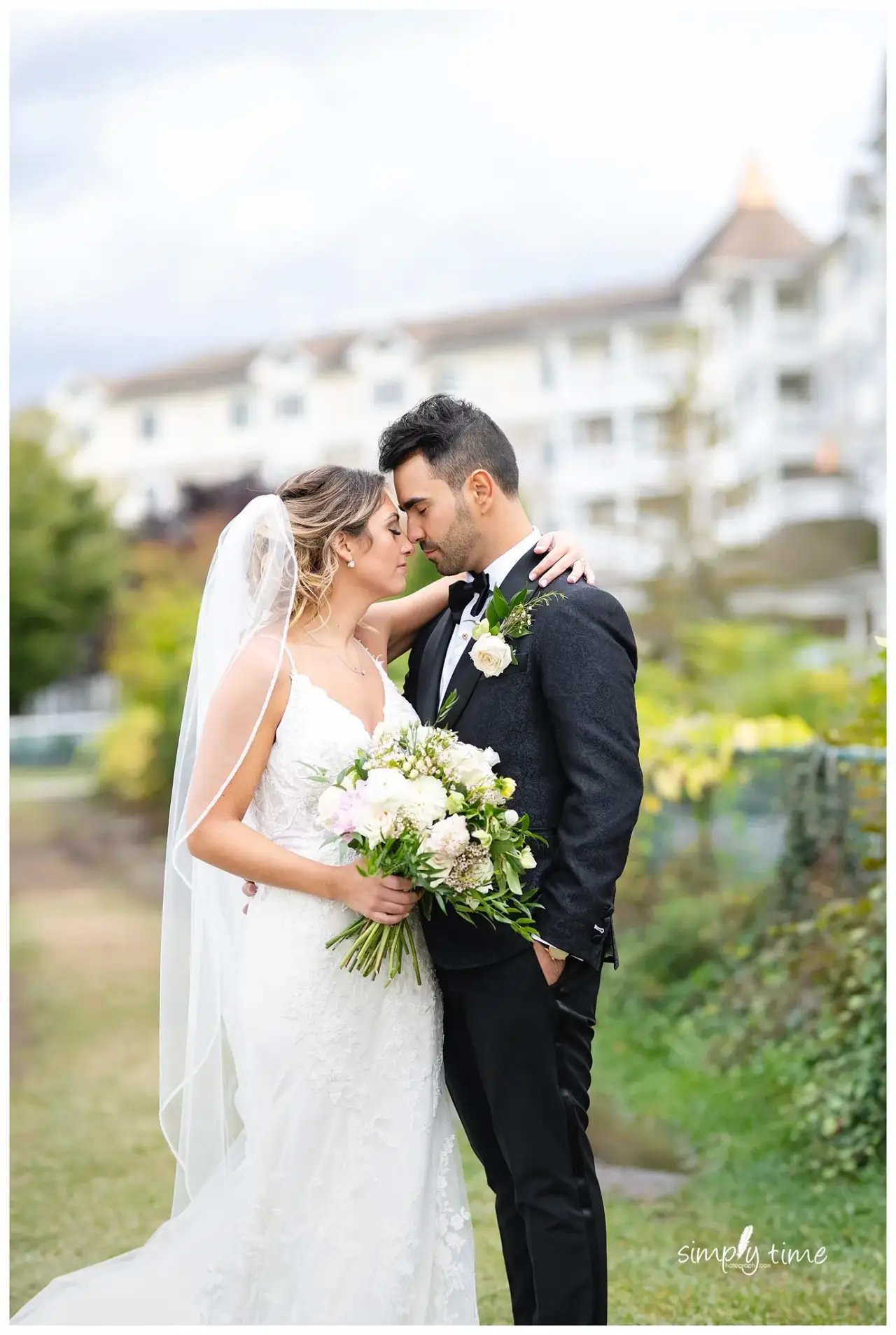 Romantic wedding moment in custom Adrian Jules suit