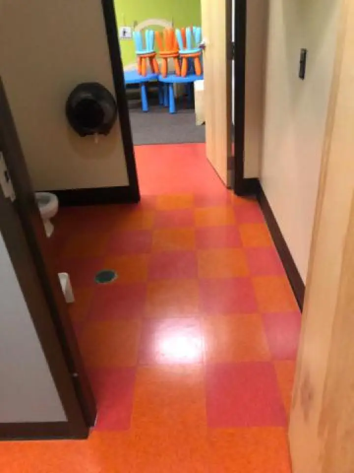 professionally cleaned red and orange bathroom tile