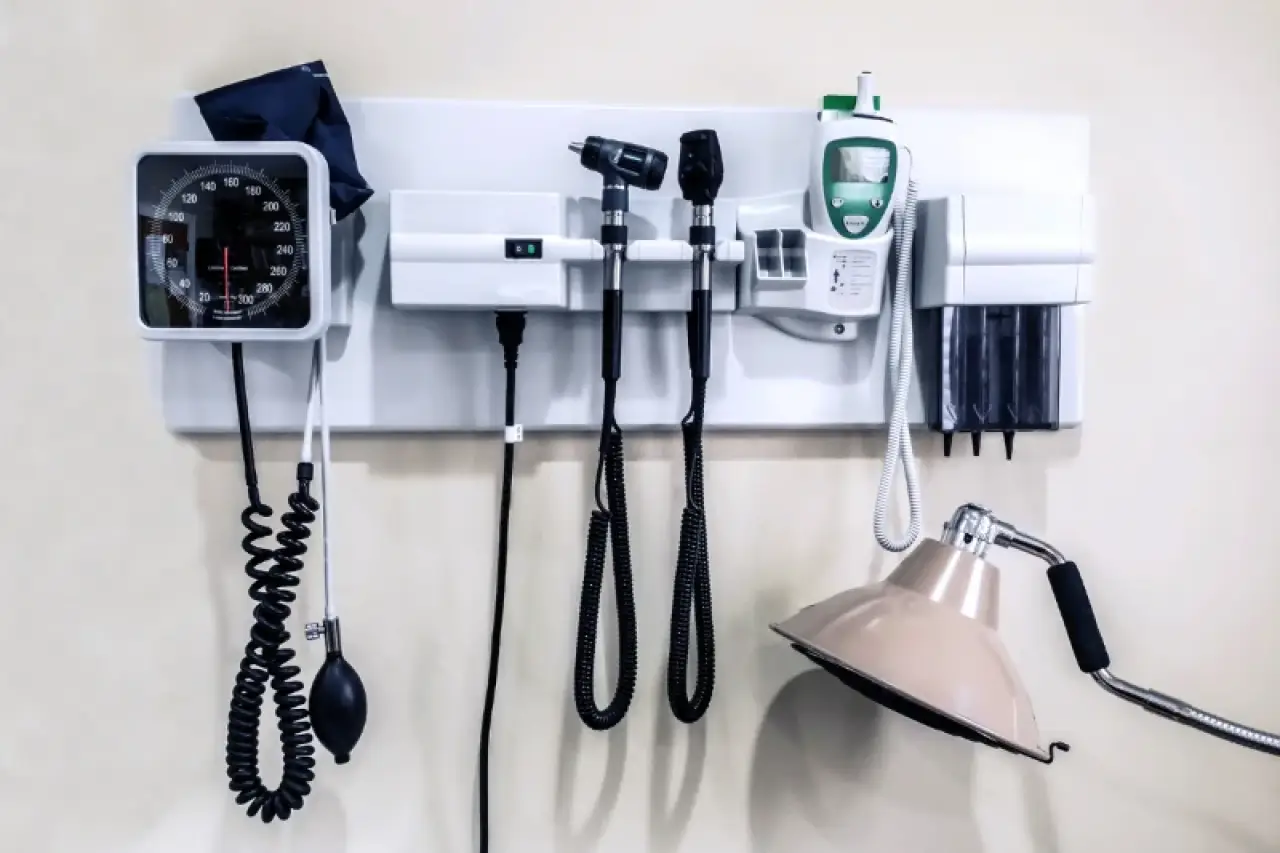 blood pressure cup, thermometer, and other medical supplies in medical office